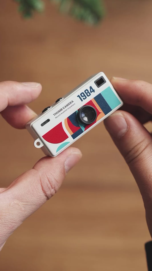 G6 - Retro Thumb Mini Camera